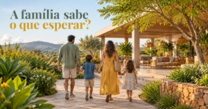 Família caminha por um jardim de hotel em direção a uma área de convivência